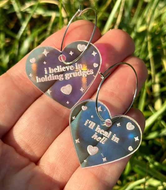 Iridescent I believe in holding grudges, I’ll heal in hell Heart Hoop Earrings