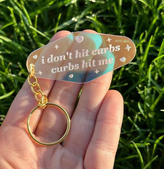 I don’t hit curbs, curbs hit me Iridescent Acrylic Motel Keychain